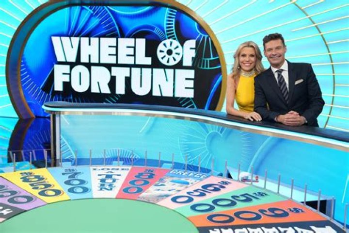 The Woman Behind The 'Wheel Of Fortune' Host